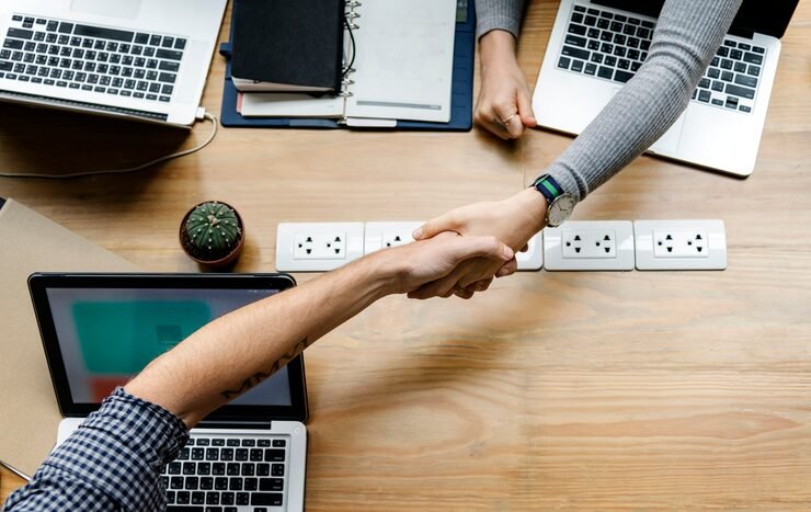 Business people shaking hands agreement
